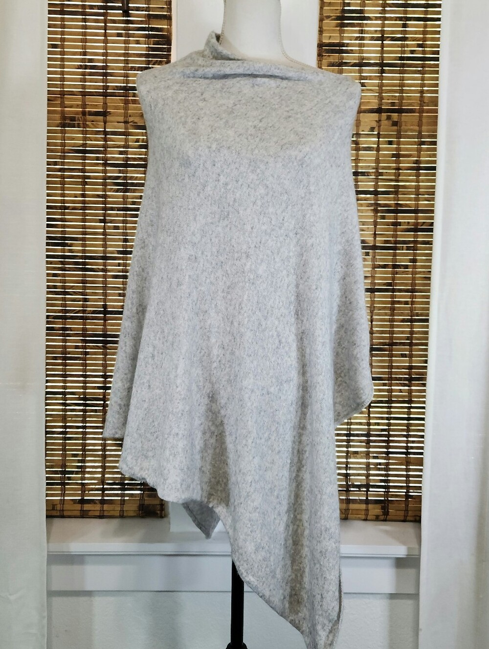 Elevate your layering game with this stunning Dalle Piano Poncho Size OS